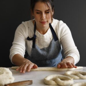 Jessica rolling pretzels.