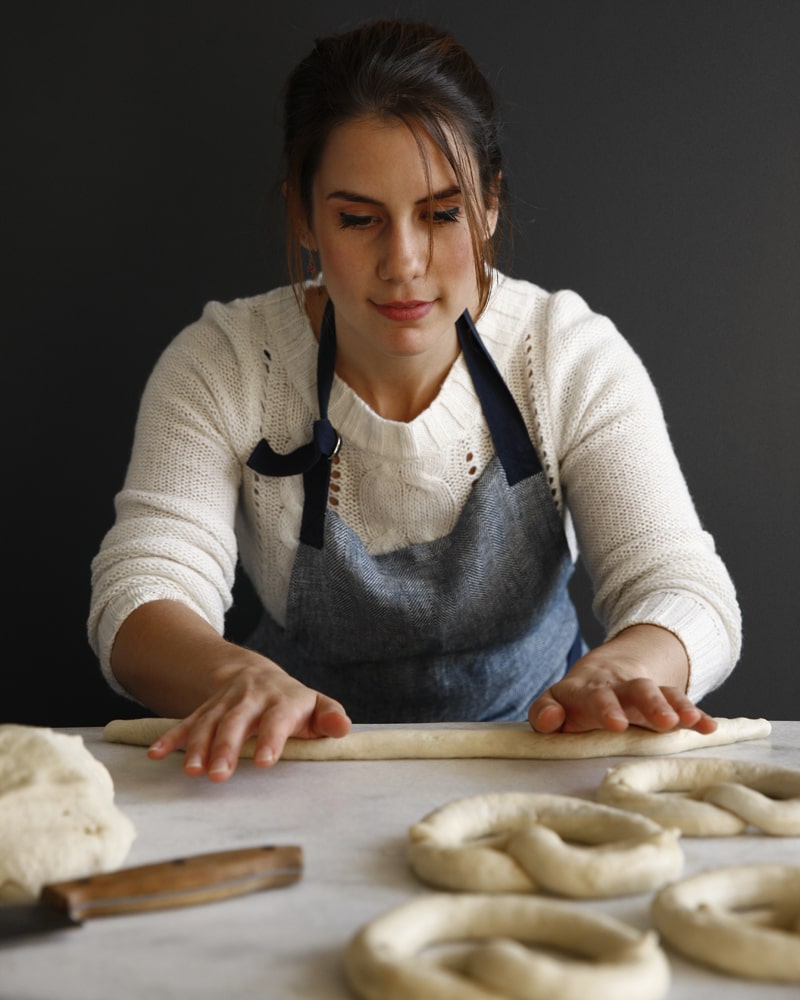 Jessica rolling pretzels.